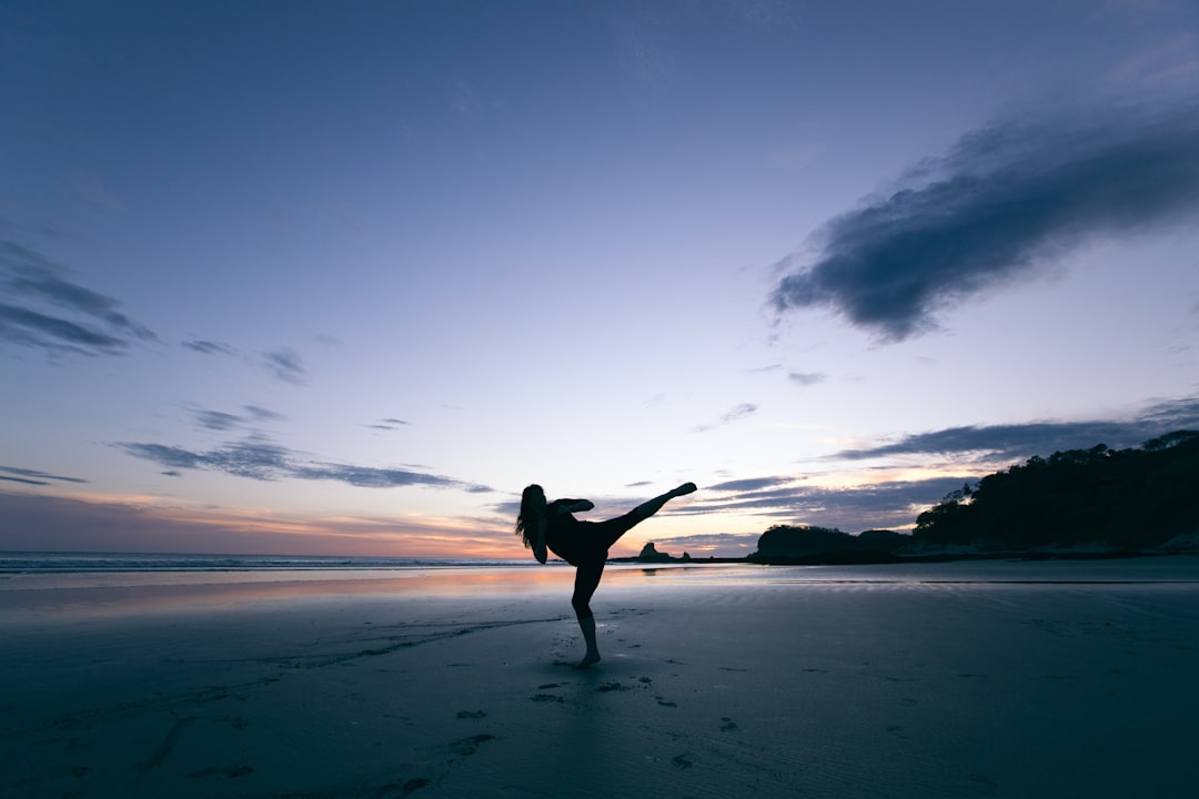 silhouette-of-person-kicking-on-mid-air-hn-4k2diuws